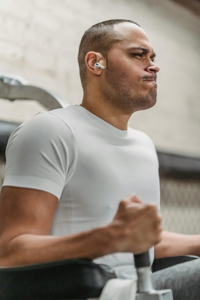 pexels-photo-6455959-6455959 African American man working out in gym, showcasing strength and determination.