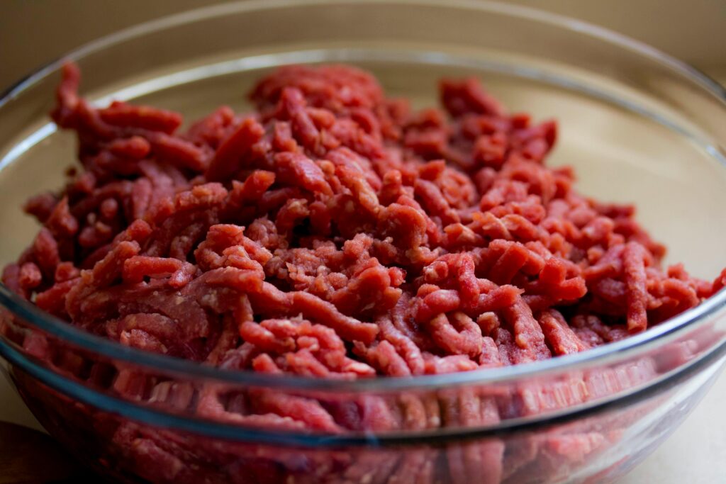 pexels-photo-128401-128401 High-quality image of fresh ground beef in a glass bowl, ideal for culinary and food-related themes.