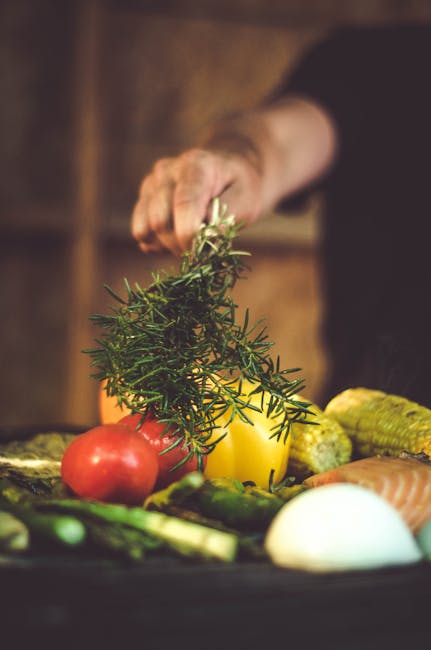 pexels-photo-1566867-1566867 Temperos A vibrant assortment of fresh vegetables and herbs, including tomatoes and rosemary, being prepared for grilling.