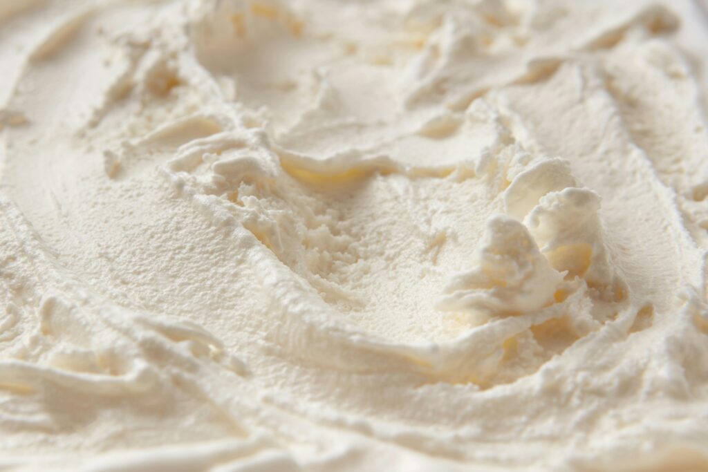 pexels-photo-9227718-9227718 Detailed close-up of creamy white ice cream texture, highlighting its smooth and soft consistency.